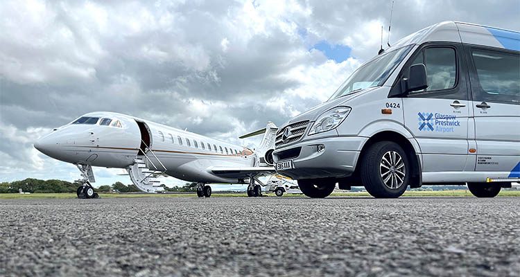 Private jet next to a Glasgow Prestwick Airport minibus