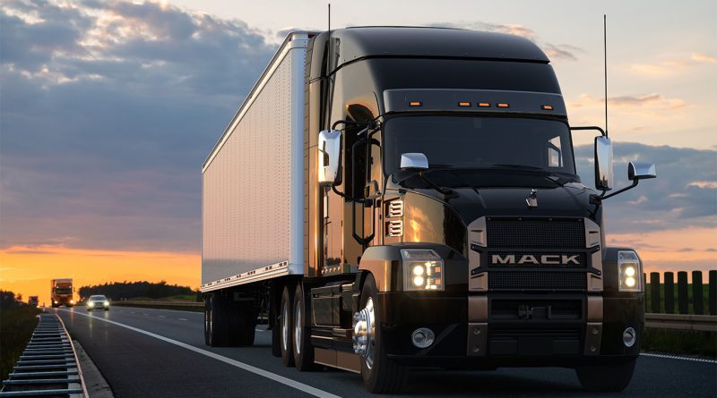 Black Mack Trucks vehicle driving on highway