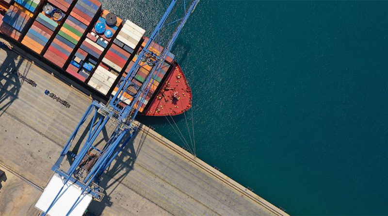 Shipping containers being loaded onto cargo ship to support Gulf shipping risks article