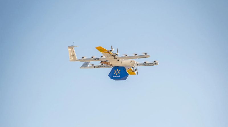 Walmart drone delivery service flying through sky with package