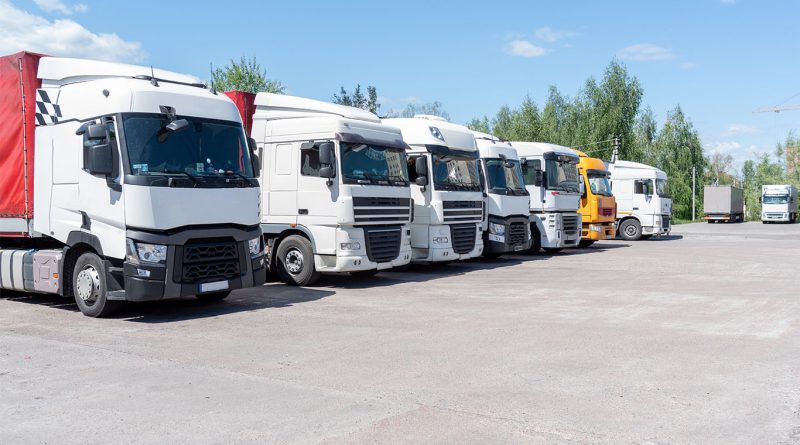 Row of trucks parked in parking spaces