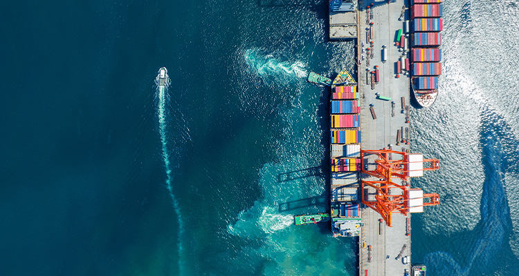 Cargo container Ship running to Bridge Cargo Shipyard Container ship under the crane Sea Port service logistics and transportation. International Shipping Depot Customs Port for import export trade.