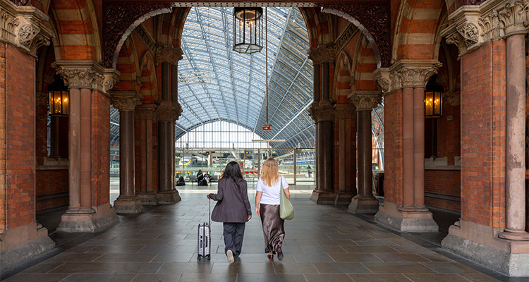 view inside St Pancras International Station in London, known for its distinctive Victorian Gothic architecture and impressive train shed.