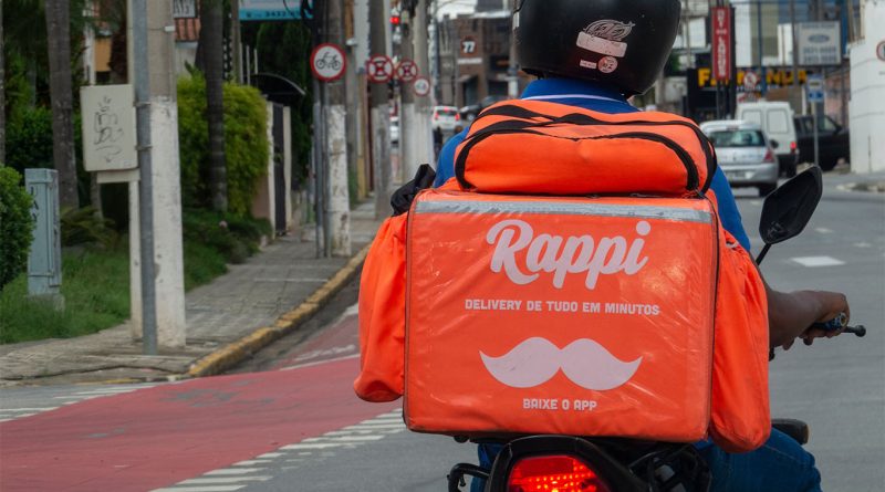 Amazon and Rappi partnership concept with couriers and city map