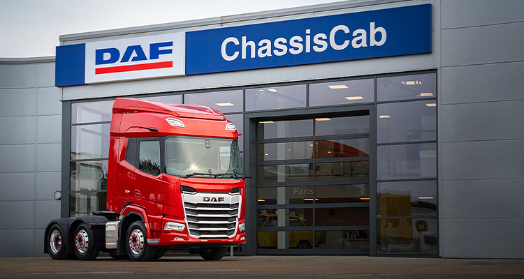 Chassis Cab DAF proves family values drive success and a positive working environment a red DAF truck parked in front of a DAF Chassis Cab dealership